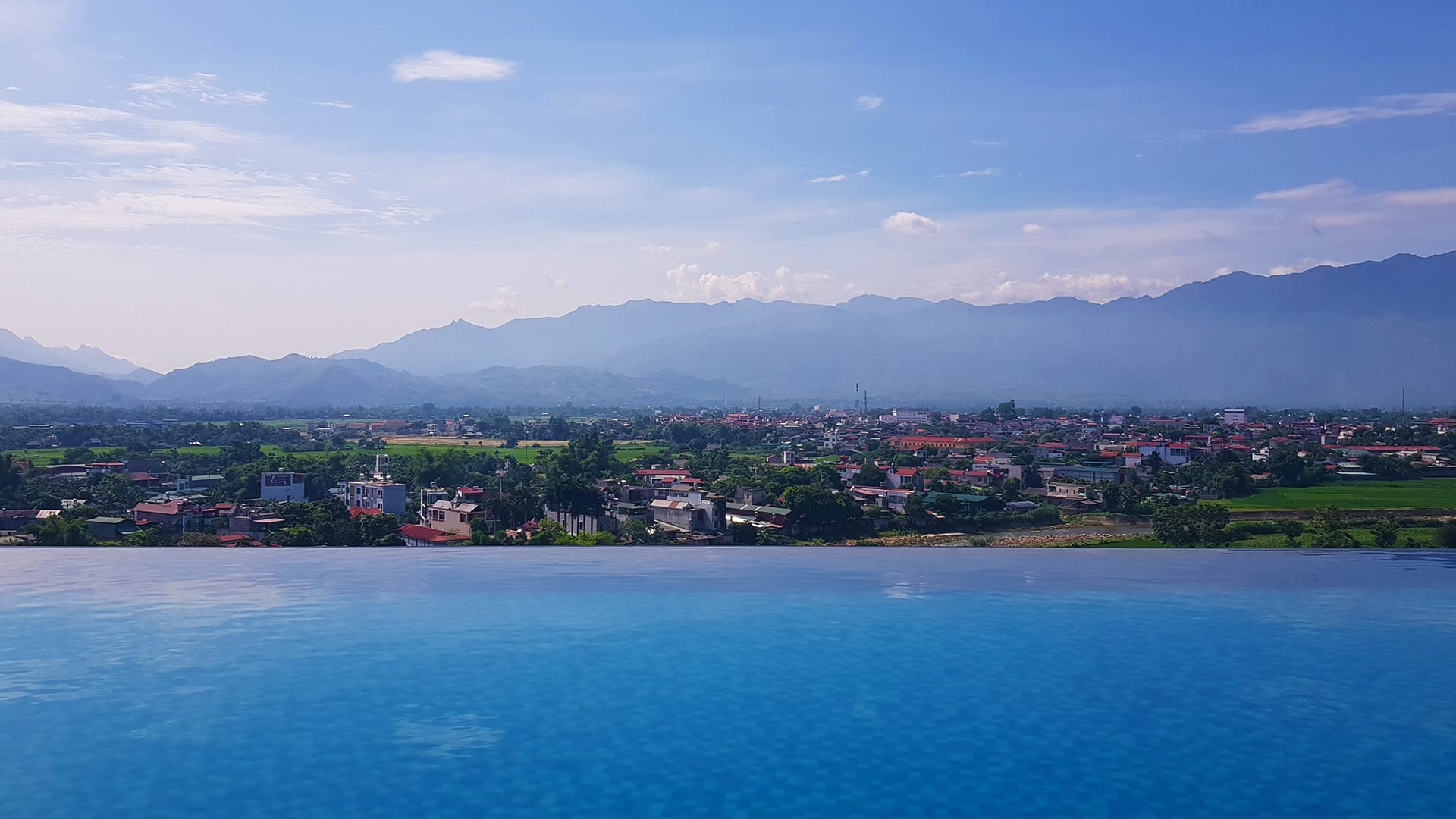 the view from the infinity pool at the big hotel in Nghia Lo