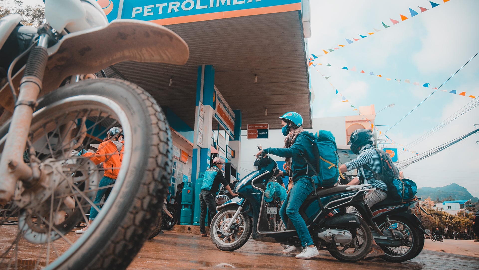 some locals stopping off at a petrol station in North Vietnam