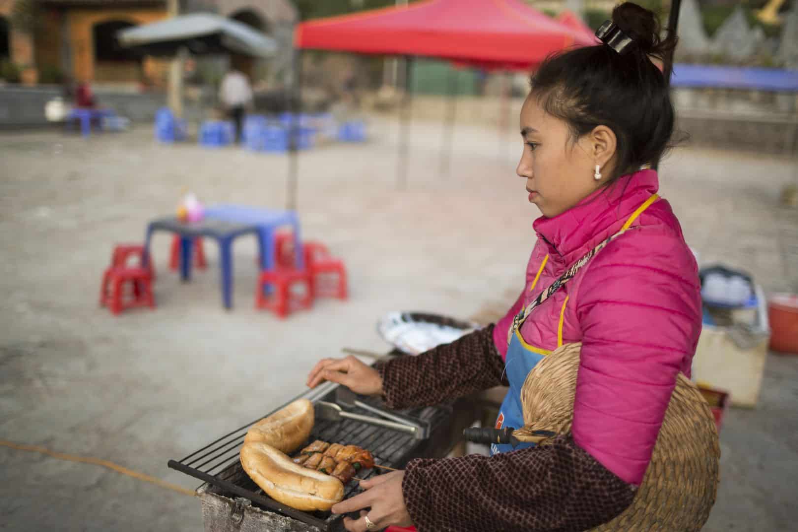 a street vendor in a local market in Ha Giang - Dustin Silvey