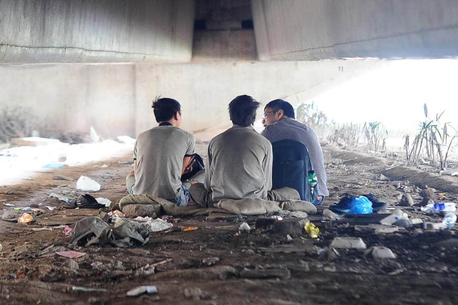 Blue Dragon staff talking with street kids in Hanoi