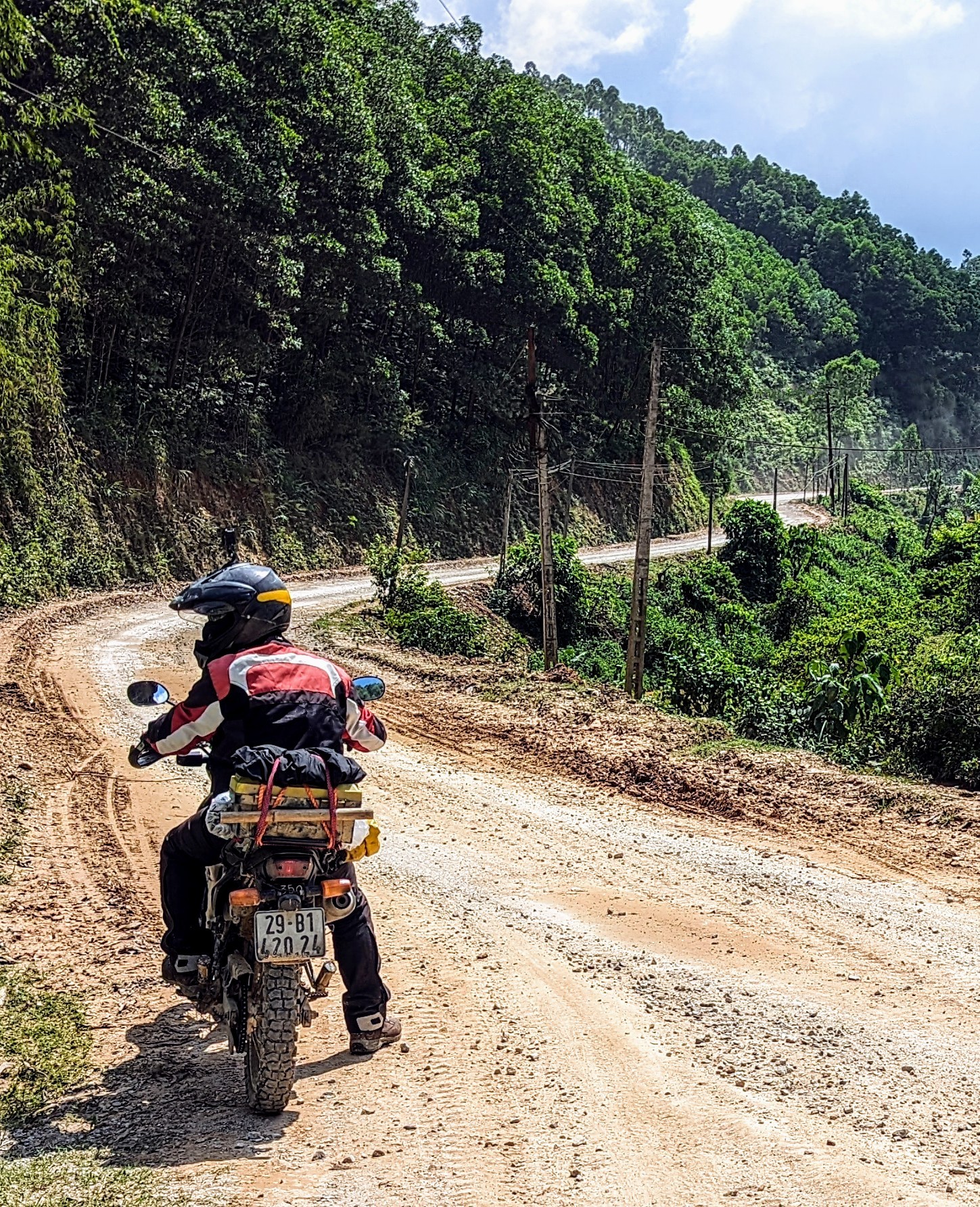 Rentabike rider on tour stopped on a road still under construction