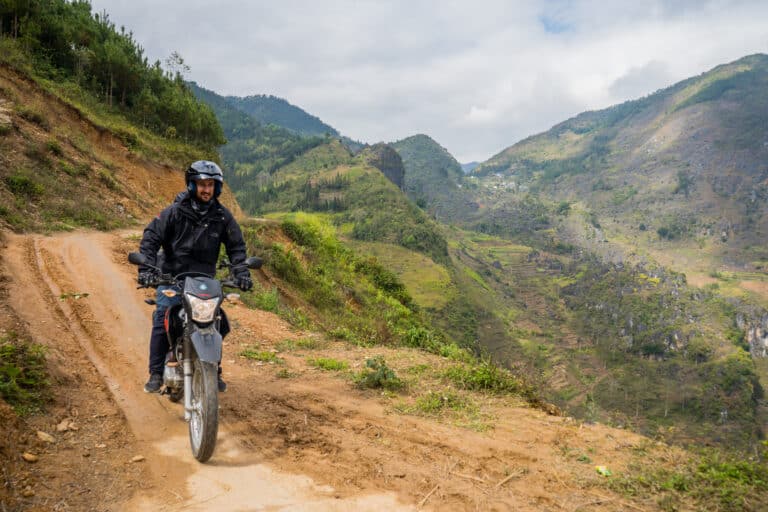 riding a Honda XR 150 on a fun dirt road near Sapa