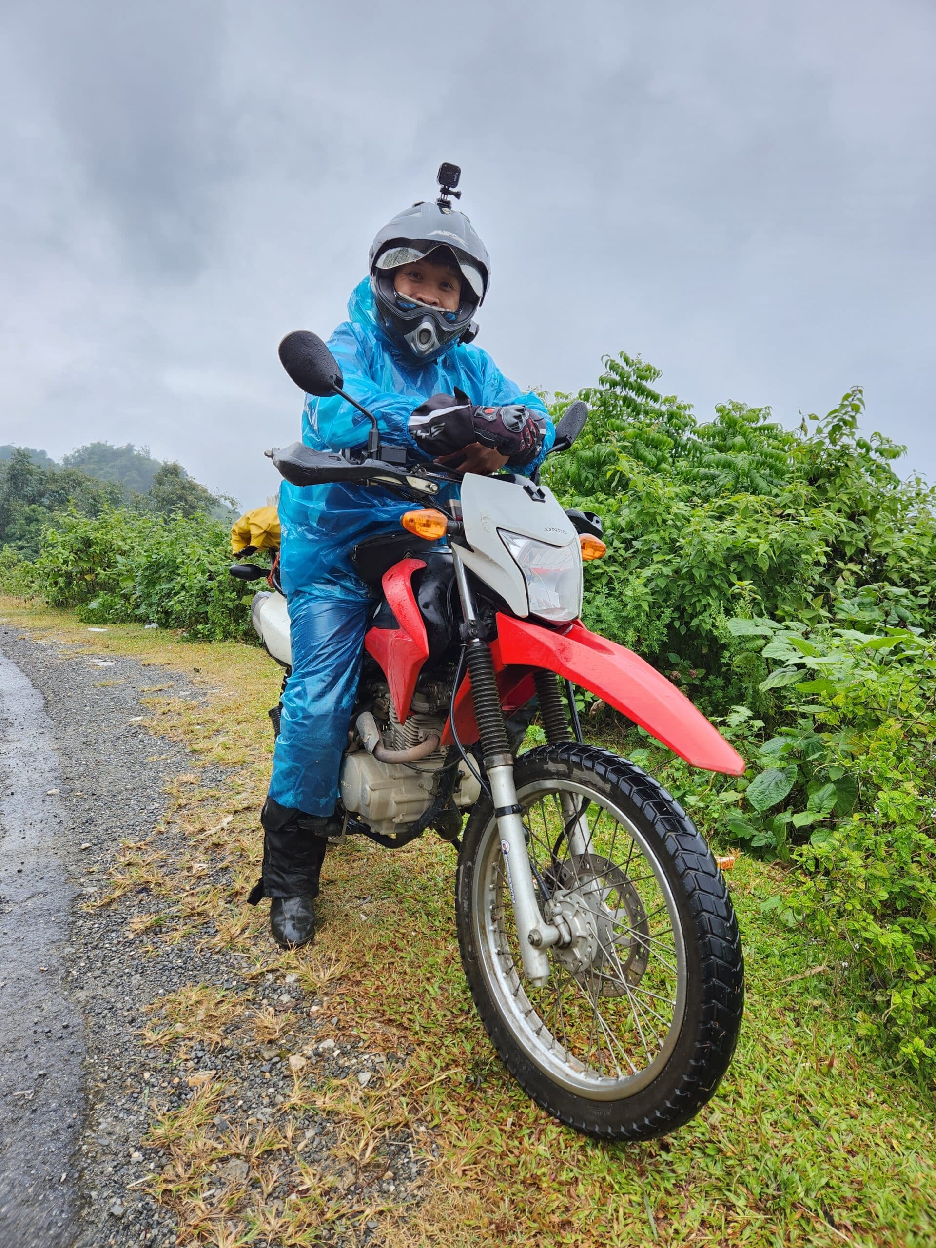 Feeling the cold wet weather on the waterfall road