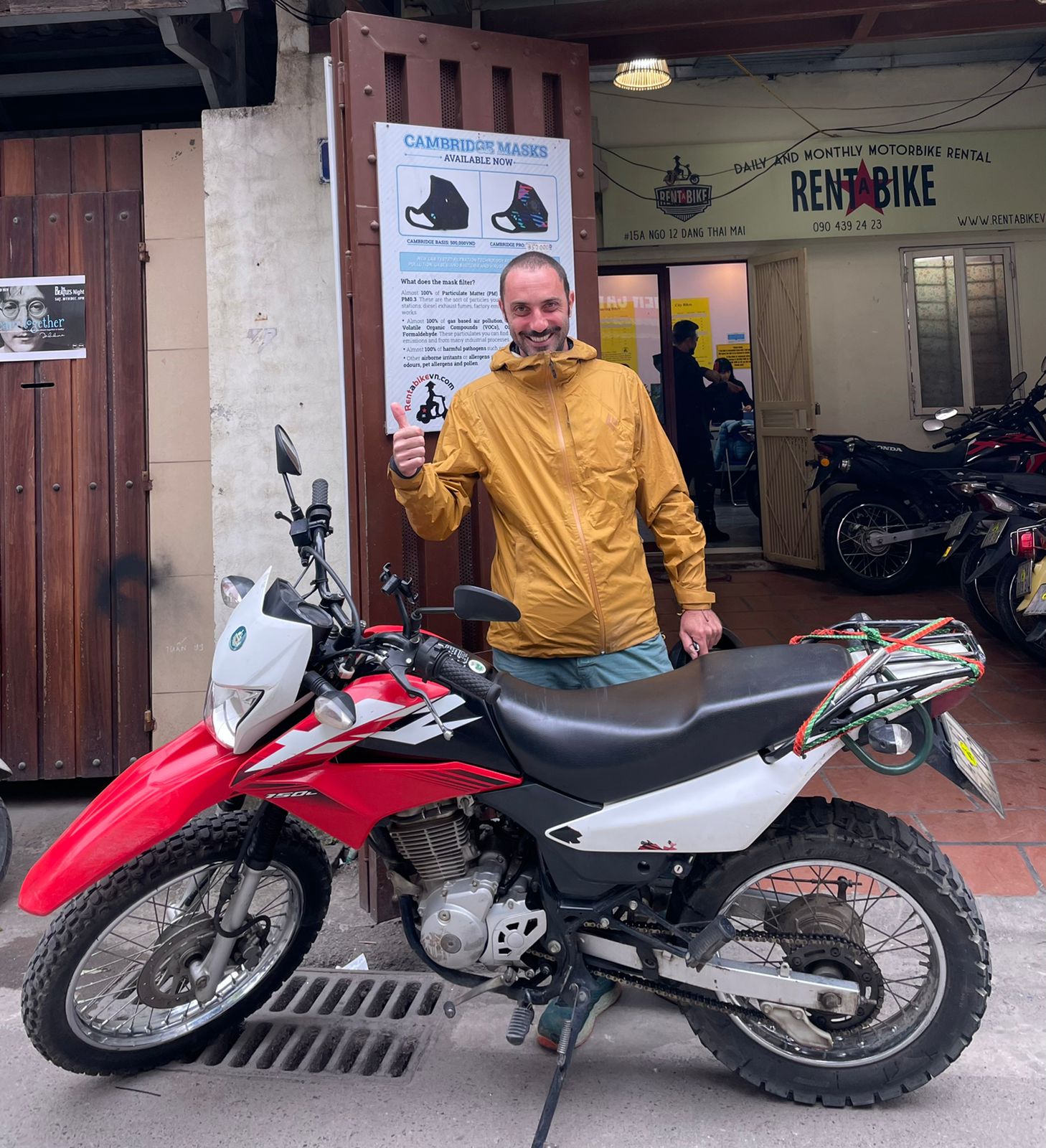 Rentabike customer outside shop with his Honda XR