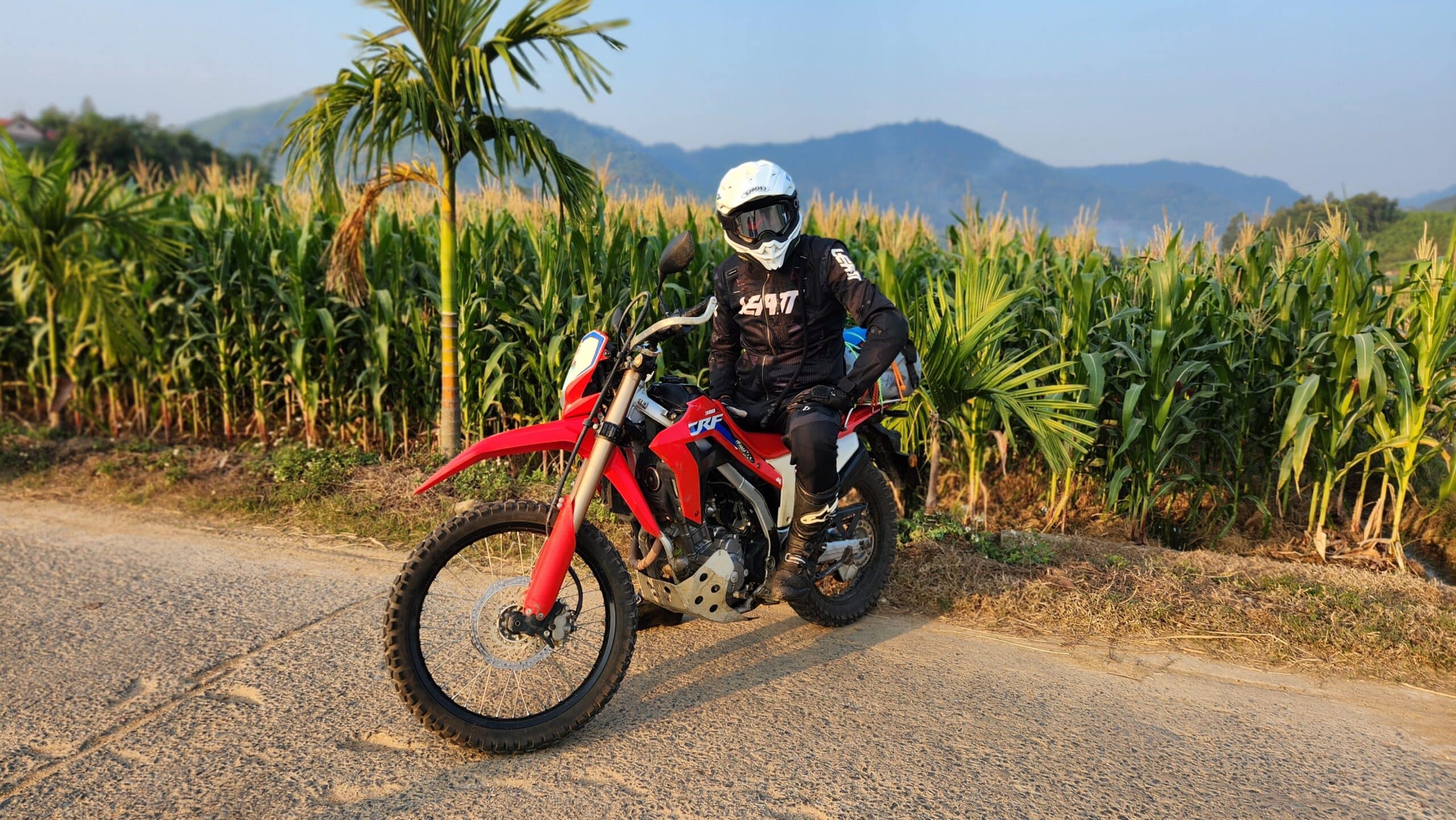 Tom in the fields near Thac Ba Lake on his Honda CRF300l