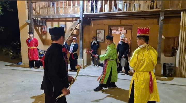 a traditional dancing performance by villagers in a Dao Village