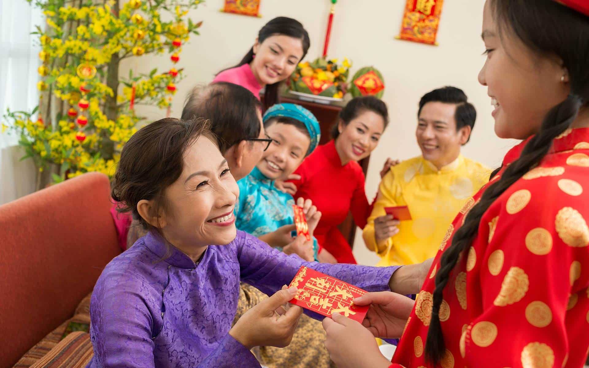 Vietnamese traditional Tet custom giving lucky money.