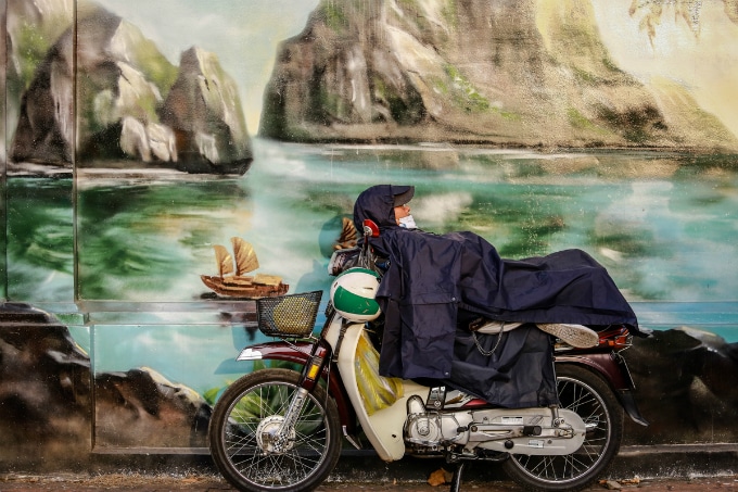 Keeping warm on a motorbike in vietnam