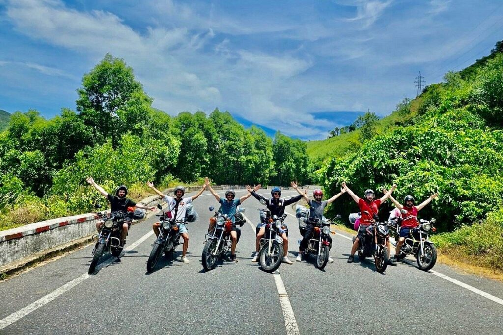 a group of happy riders on empty highway at tet