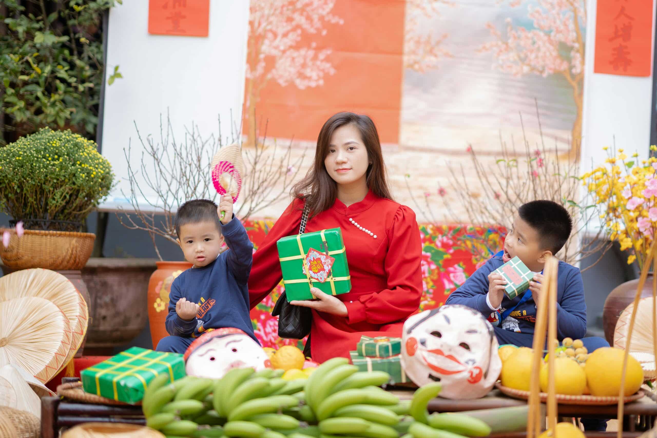 a woman happy with her children at home for tet in vietnam
