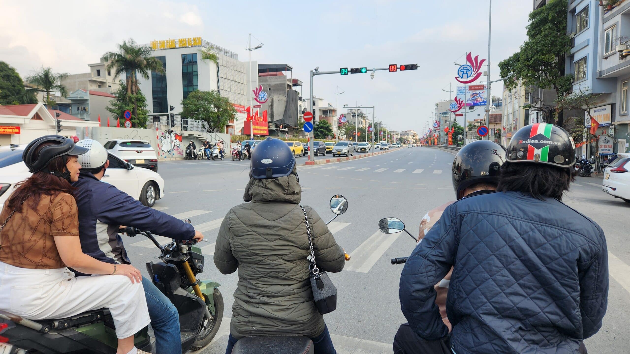 motorcycle drivers waiting at a traffic light in northern vietnam