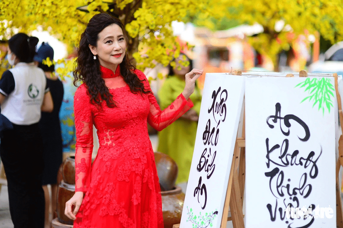 wearing a beautiful red dress for good luck at tet in vietnam